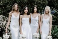 white slip maxi bridesmaid dresses with deep scoop necklines are a very edgy and trendy solution to rock