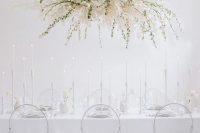 21 an ethereal white bloom and greenery wedding installation instead of a usual wedding centerpiece