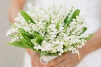 a cute small white wedding bouquet