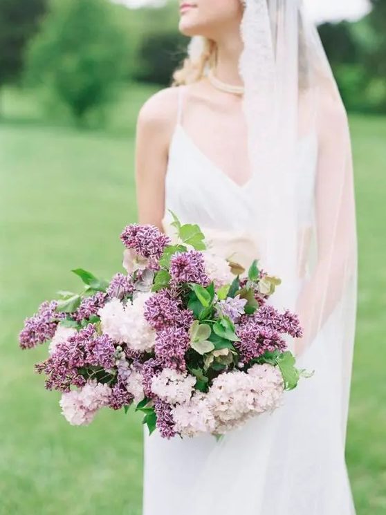 a wildly romantic blush and purple lilac wedding bouquet is a gorgeous idea for a garden bride, for a spring or summer one