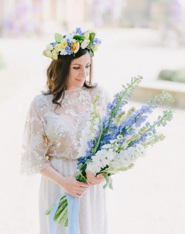 a beautiful blue and white delphinium wedding bouquet with blue ribbons is a lovely and romantic idea for a spring bride