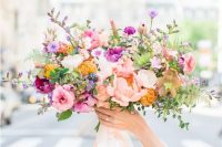 30 a colorful spring wedding bouquet with hot pink, blush, mustard and lilac blooms with blush ribbons