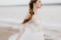 a bustier wedding dress with a lace applique