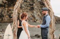 a boat-shaped driftwood wedding arch is a very beach idea, and can be a nice fit for a surfer wedding