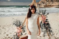 a boho lace mermaid wedding dress with cap sleeves and a train plus bright florals