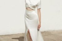 a casual and modern bridal look with a silk tied up top with short sleeves and a maxi skirt with a front slit