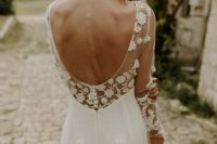 a dreamy and romantic A-line wedding dress with a cutout back, petal appliques and illusion sleeves is a beautiful and delicate solution