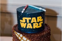 a geeky Star Wars groom’s cake done with sabers, gold letters and the famous quote is a lovely idea for a party