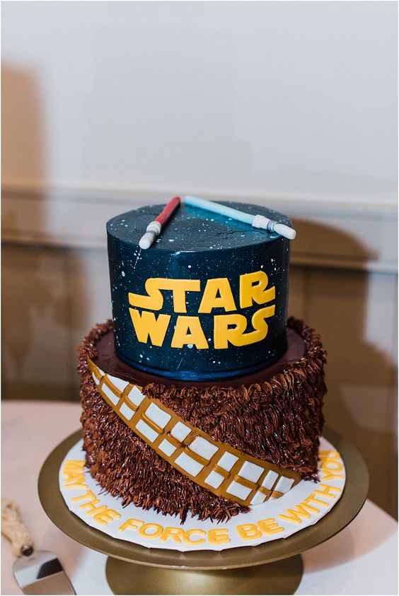 a geeky Star Wars groom's cake done with sabers, gold letters and the famous quote is a lovely idea for a party
