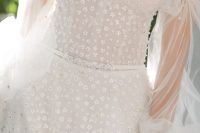 a girlish off the shoulder wedding dress with embellishments and floral appliques, with puff sleeves is a lovely idea