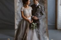 a glam bridal separate with an embellished cropped bodice and a layered graphite grey skirt