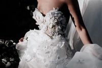 a gorgeous strapless floral applique wedding dress with appliques on the bodice and a bit on the skirt is very romantic