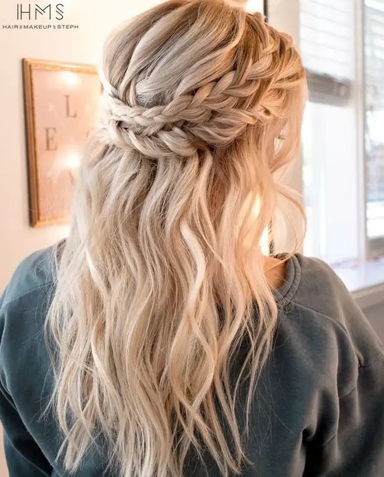 a half updo with a double halo braid and textural hair down for a boho bride