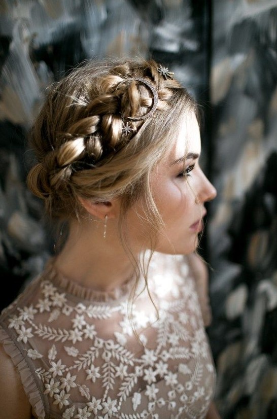 a halo braided updo with some star hair pins and a moon one for an ultimate boho look