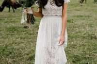 a lace bridal separate with a crop top with a high neckline and short sleeves, a midi skirt and nude booties