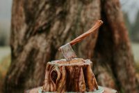 a lumberjack groom’s cake showing a tree stump and an axe looks very cool and will fit a rustic party or a party of a hiker