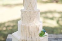 a neutral boho macrame wedding cake with fresh succulents looks really unusual and inspiring