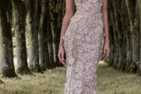 a sparkling spaghetti strap wedding dress with blush floral appliques, a deep neckline and a train is a rormantic idea for spring