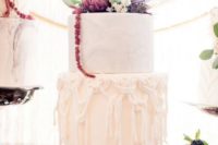 a white wedding cake with sugar macrame decor and a marble tier plus dramatic dark blooms on top