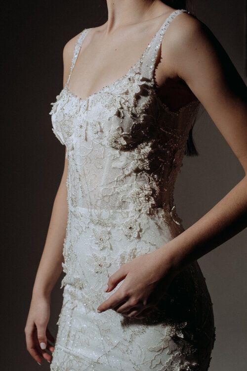 an exquisite fitting wedding dress with intricate floral appliques and embellishments is a very chic idea to go for