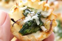 asparagus and caramelized onion tartlets are an easy and delicious spring appetizer