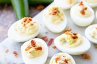 deviled eggs with bacon and cheese are a popular and simple appetizer for any weddings