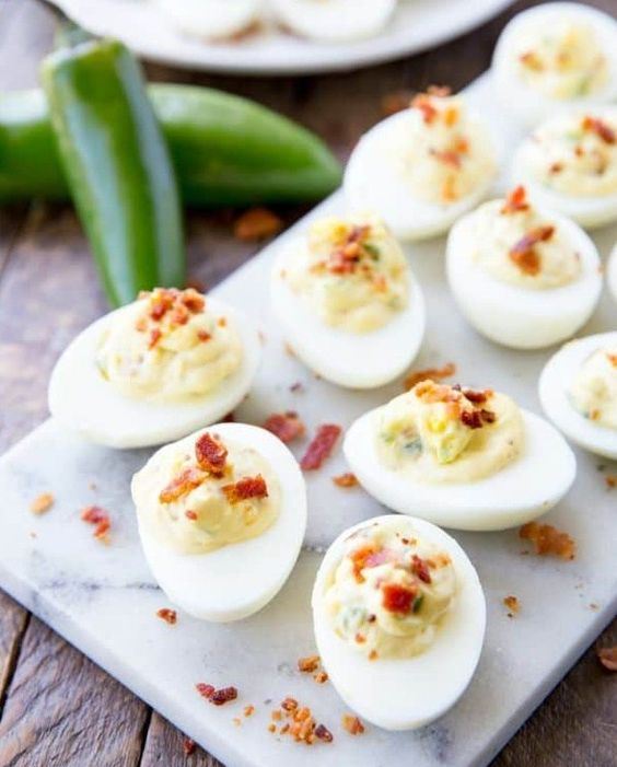 deviled eggs with bacon and cheese are a popular and simple appetizer for any weddings