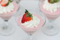 pink souffle in glasses with whipped cream and strawberries are nice for your spring bridal shower