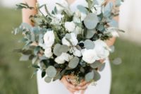 a beautiful textural wedding bouquet of greenery and white blooms will work for most of bridal styles
