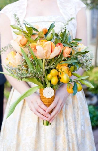 a bright wedding bouquet of yellow and orange tulips, greenery and herbs, with kumquats and ribbon wraps is amazing