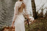 a chic mermaid wedding dress with a lace bodice, long sleeves, an open back and a plain skirt with a train