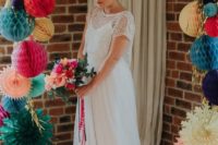 a chic spaghetti strapl plain wedding dress with an embellished crop top with short sleeves