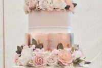 a gorgeous formal wedding cake with white and blush tiers, rose gold tiers, white and blush blooms and foliage