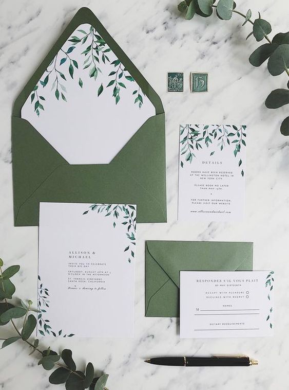 a green and white wedding invitation suite with leafy patterns looks very natural and chic