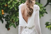 a lovely A-line plain wedding dress with embellishments and lace appliques, a low back and long sleeves is wow