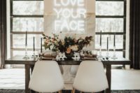 a modern marble reception backdrop with an acrylic neon sign is what you need for a bright and welcoming reception