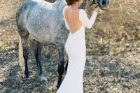 a modern sexy mermaid plain wedding dress with a low back, long sleeves and a train is a refined and gorgeous idea to rock