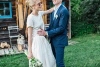 a modern wedding separate with a plain top with short sleeves and a full skirt for a backyard bride
