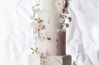 a refined blue and white wedding cake with gold leaf decor, sugar blush and white blooms is a very chic idea