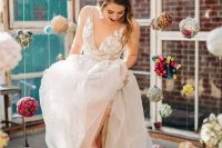 a romantic A-line wedding dress with a lace applique bodice, layered skirt, thick straps and a V-neckline plus metallic boots