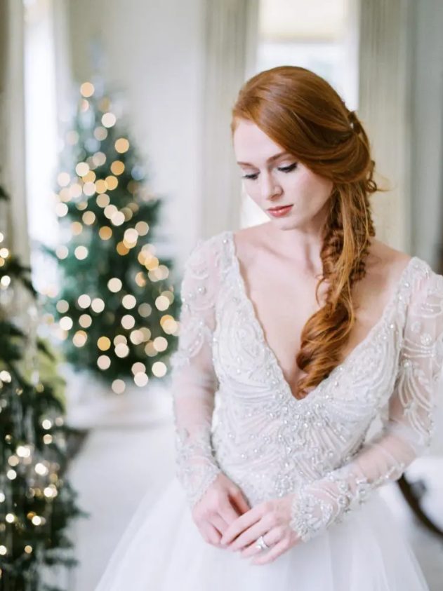 a romantic embellished wedding ballgown with a deep V-neckline, long sleeves and a plain full skirt is a beautiful idea