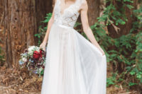 a romantic wedding dress with a lace bodice, an illusion neckline and a pleated skirt plus a floral crown