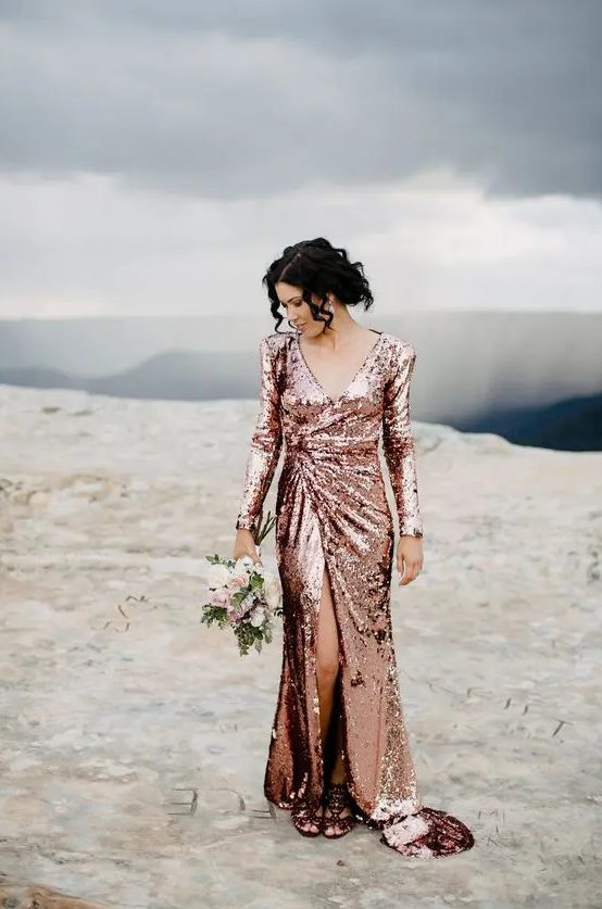 a rose gold sequin A-line wedding dress with a slit, a V-neckline and long sleeves is a timeless idea to rock