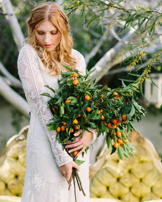 a super lush and bold wedding bouquet composed of lots of greenery and kumquats is a fantastic idea to rock