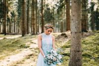 an A-line high neckline blue wedding gown with a cut back, a flowy skirt for something blue
