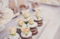chocolate naked individual wedding cakes with sugar powder and blush roses are amazing for a romantic wedding
