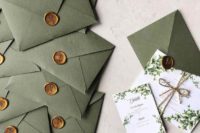 green and white wedding invitation suite with metallic seals and greenery patterns
