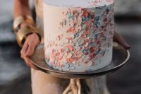 a chic textural pastel wedding cake with scallops and beads is a beautiful idea for a modern wedding