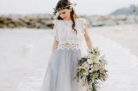 a creative beach bridal look with a white lace crop top with no sleeves and a powder blue midi tulle skirt