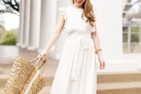 a cute plain white midi dress with ruffles and a sash, nude sandals and a straw bag for a casual summer bridal shower look